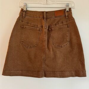 Fitted waist stretch cotton blend carmel colored  denim skirt.